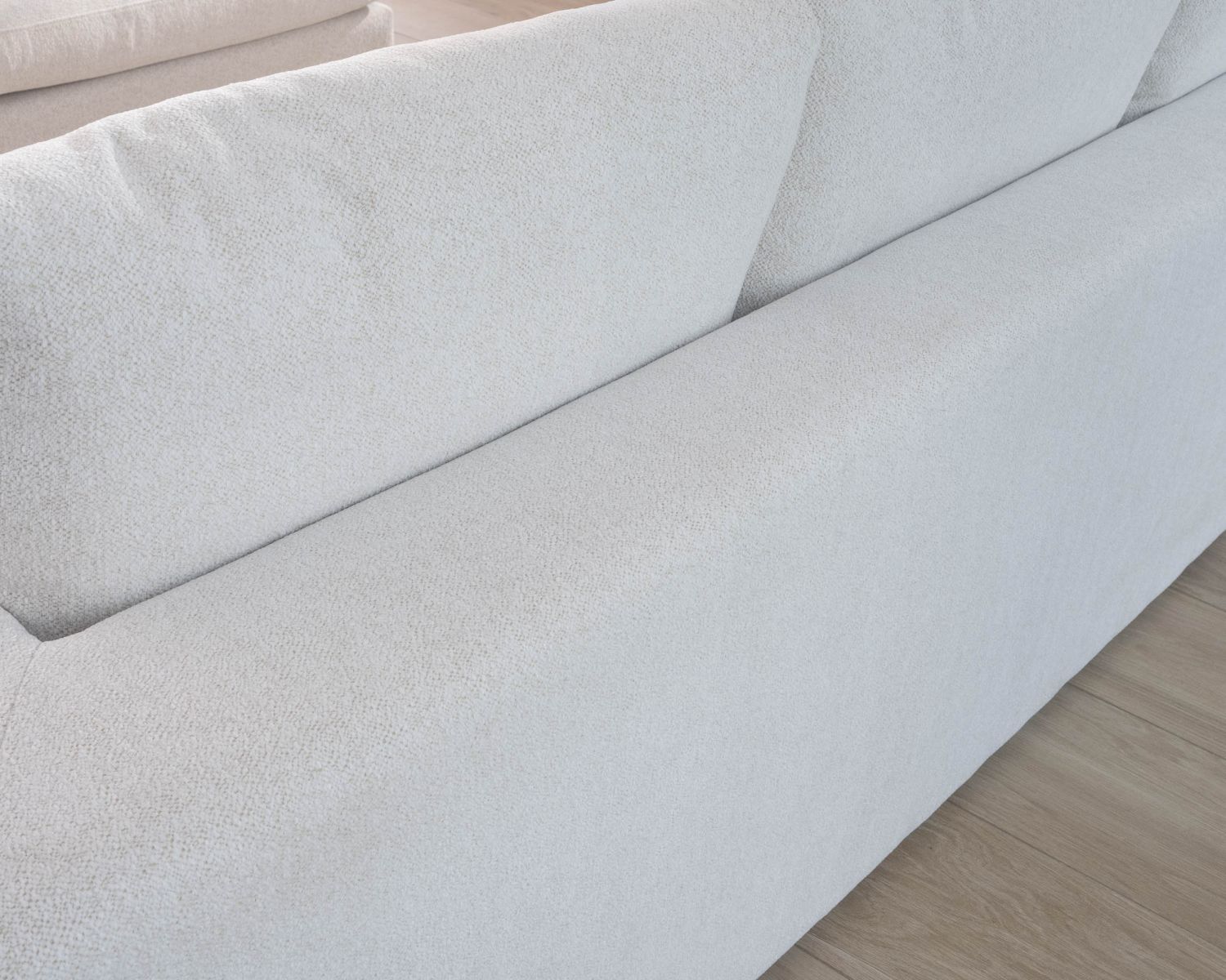 Canapé 3 places avec pouf ottoman carré en tissu doux et bouclé blanc chiné "Tuléar"