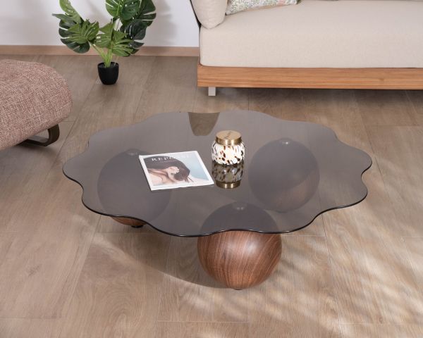 Table basse forme organique avec plateau en verre fumé "Cyléa" pieds boules