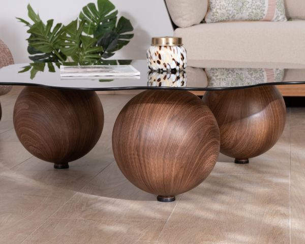 Table basse forme organique avec plateau en verre fumé "Cyléa" pieds boules